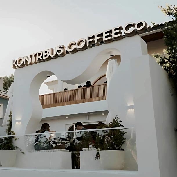 Barista Pours Water From Coffee Pot